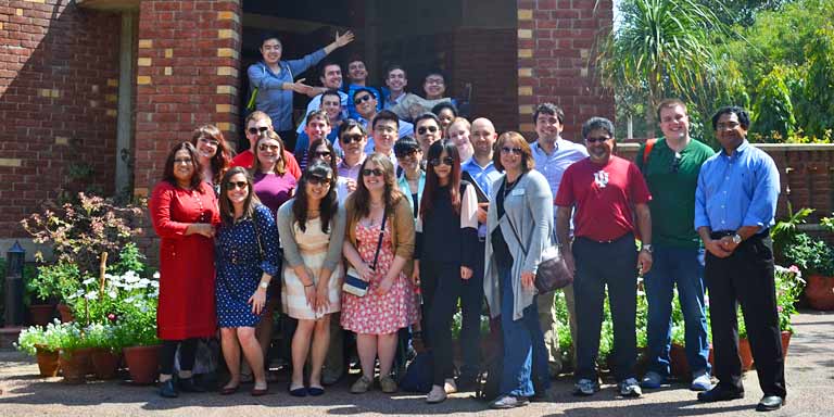 A group poses for a photo outside of the IU India Gateway.